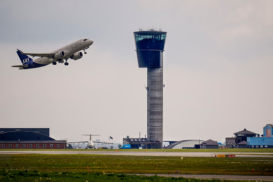 A Scandinavian Airlines SAS aircraft takes off next to the control tower at Copenhagen Airport, Copenhagen, Denmark, 24 May 2023. EPA-EFE/LISELOTTE SABROE DENMARK OUT
