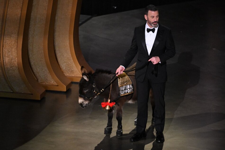 TV host Jimmy Kimmel walks onstage with a donkey during the 95th Annual Academy Awards at the Dolby Theatre in Hollywood, California. Patrick T. Fallon, AFP