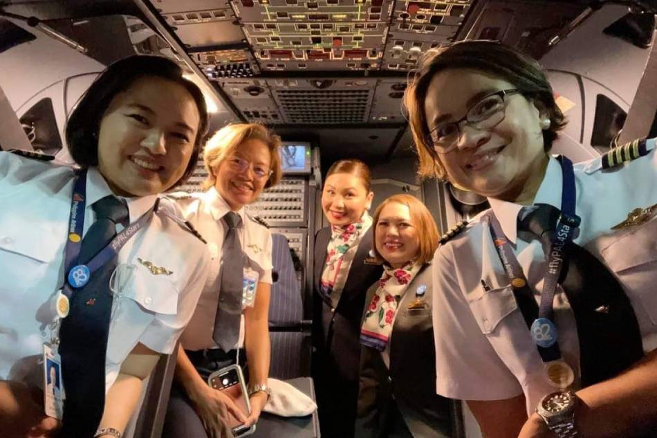 The pilots in command and the female cabin crew of flight PR110. Photo: PAL