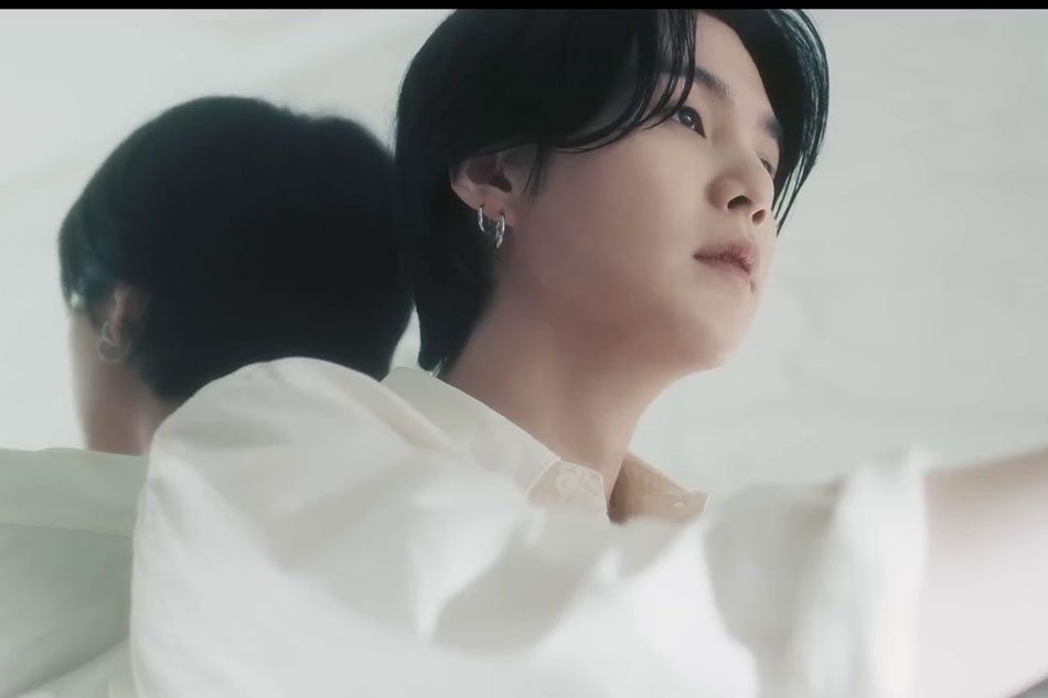 BTS member Suga in the music video for 'People Pt.2,' a pre-release track from his upcoming solo album. Screenshot from video on Hybe Labels' YouTube channel