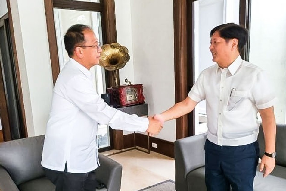 Presidential peace adviser Carlito Galvez Jr. shakes hands with President Ferdinand Marcos Jr. after accepting his offer to be the next Defense chief on Jan. 9, 2023, following the resignation of Jose Faustino Jr. Presidential Communications Office/handout
