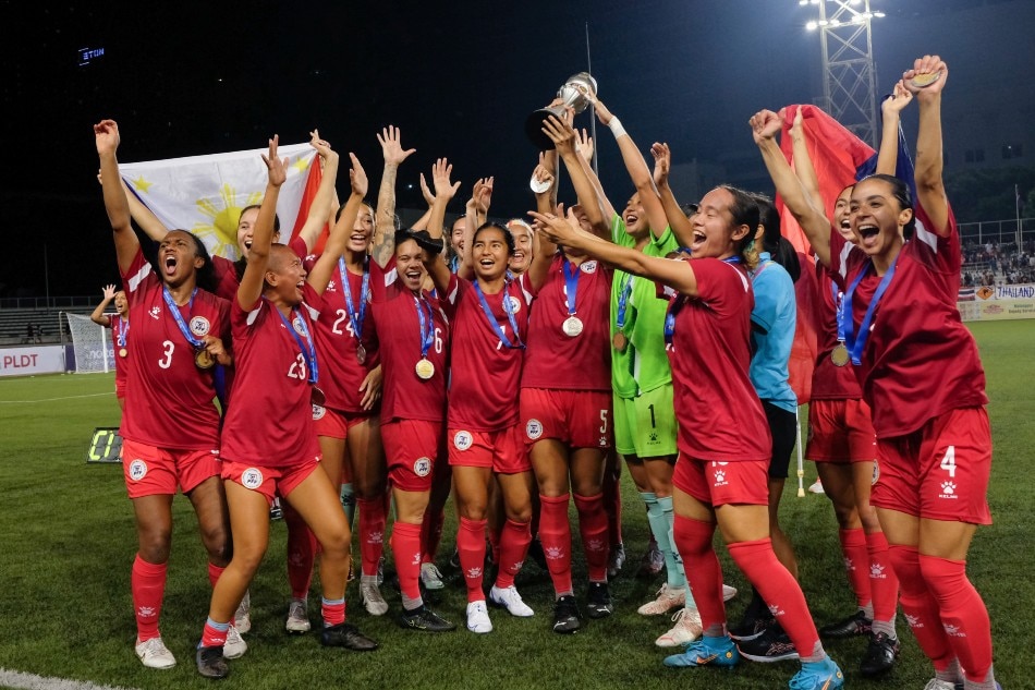 Members of the Philippine Women's National Football Team celebrate after winning the ASEAN Football Federation (AFF) Women's Championship title at the Rizal Memorial Stadium in Manila on July 17, 2022. George Calvelo, ABS-CBN News/File