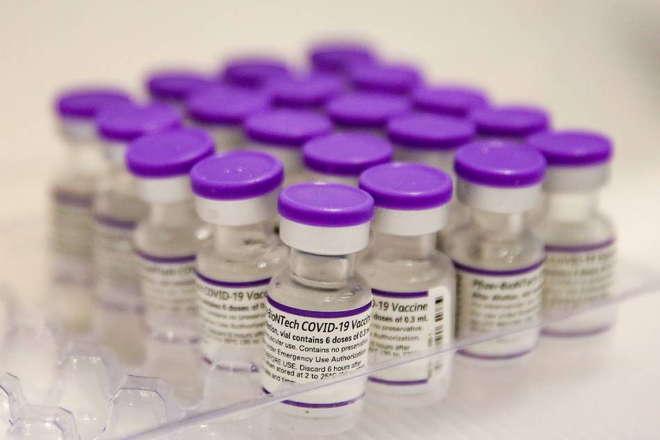 Vials of COVID-19 vaccines are being prepared at a vaccination site in Makati City on July 28, 2022. George Calvelo, ABS-CBN News/File