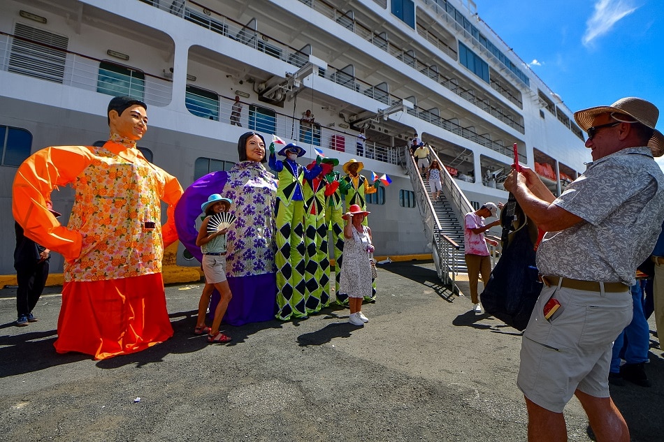 Foreign tourists from a cruise ship are given a Philippine fiesta-themed welcome as they arrive in Manila in February 2023. Mark Demayo, ABS-CBN News/File