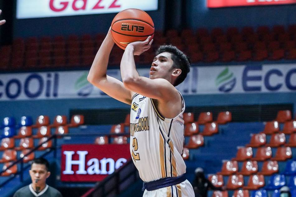 Reinhard Jumamoy puts up a jump shot in National University