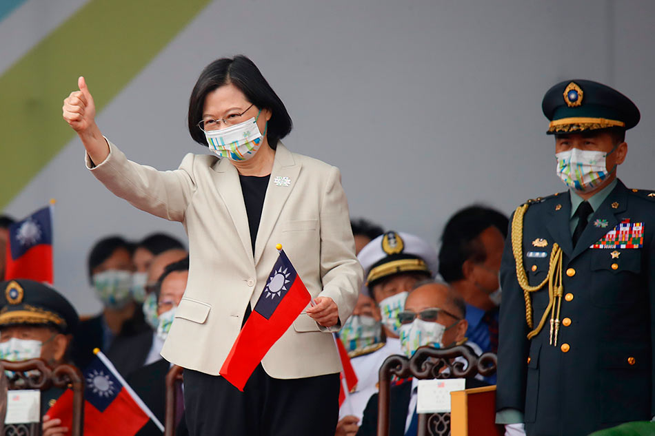 Taiwanese President Tsai Ing-wen holding a Taiwanese flag as she gestures during Taiwan's National Day celebrations outside the Presidential Palace in Taipei, Taiwan, Oct. 10, 2022. Daniel Ceng Shoue, EPA-EFE/File 