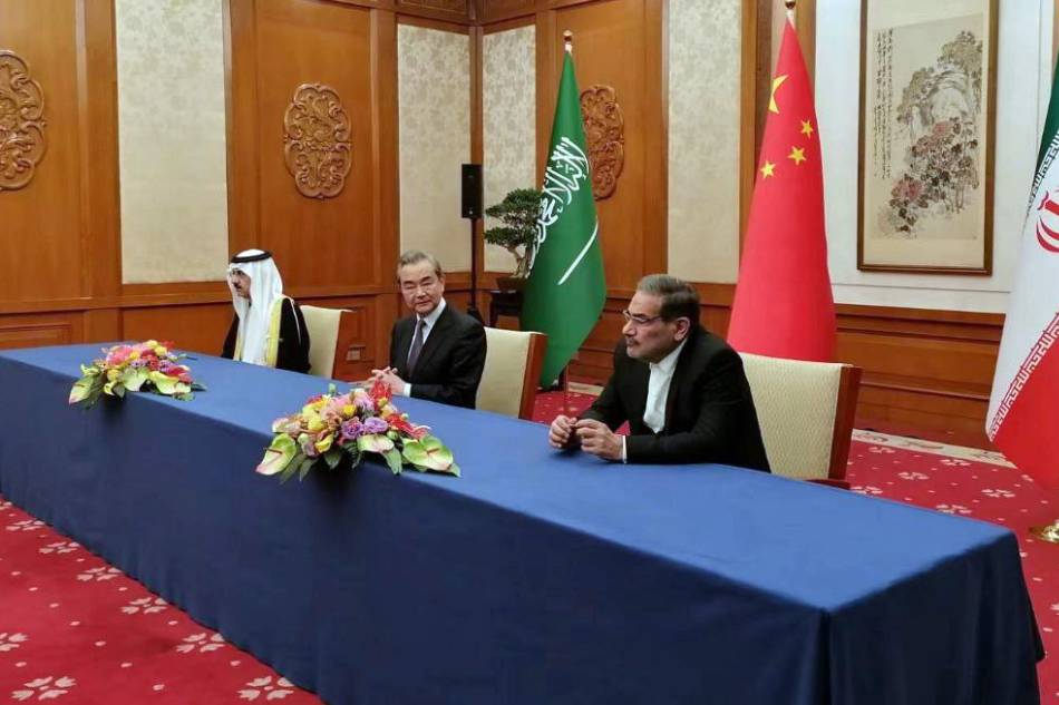 A handout photo made available by Nournews agency shows (R-L) Iranian secretary of the Supreme National Security Council Ali Shamkhani, Director of China