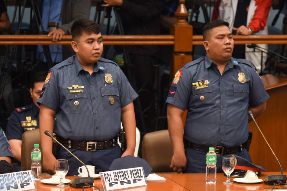 Caloocan police PO1 Jeffrey Perez and PO1 Ricky Arquilita, who were involved in the death of Carl Angelo Arnaiz, in a Senate hearing in 2017. George Calvelo, ABS-CBN News/File.