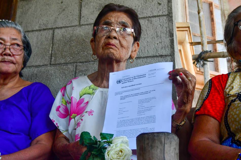 Maria Lalu Quilantang of Malaya Lolas hold a copy of the UN CEDAW decision. Mark Demayo, ABS-CBN News