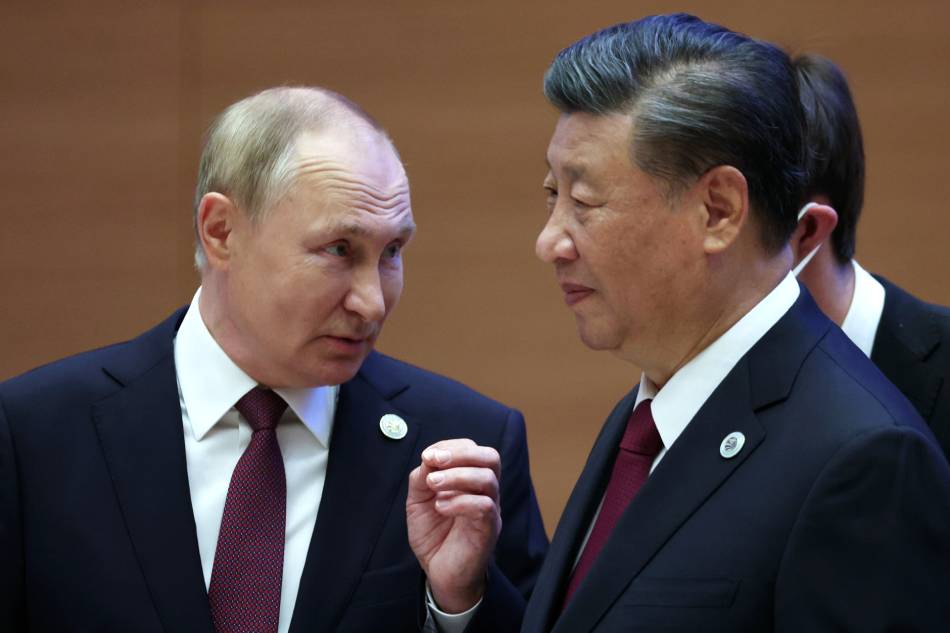 Russian President Vladimir Putin (L) speaks with Chinese President Xi Jinping after the meeting in narrow format of the 22nd Shanghai Cooperation Organisation Heads of State Council (SCO-HSC) Summit, in Samarkand, Uzbekistan, Sept. 16, 2022. Sergei Bobylev, Sputnik, Kremlin Pool/EPA-EFE/File