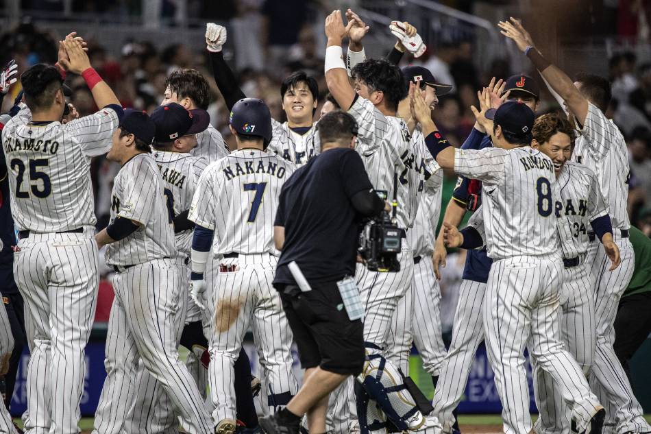 Japanese pitcher Shohei Ohtani (C) celebrates with teammates after winning during the 2023 World Baseball Classic semifinals match between Mexico and Japan at loanDepot park baseball stadium in Miami, Florida, USA, 20 March 2023. Cristobal Herrera-Ulashkevich, EPA-EFE.