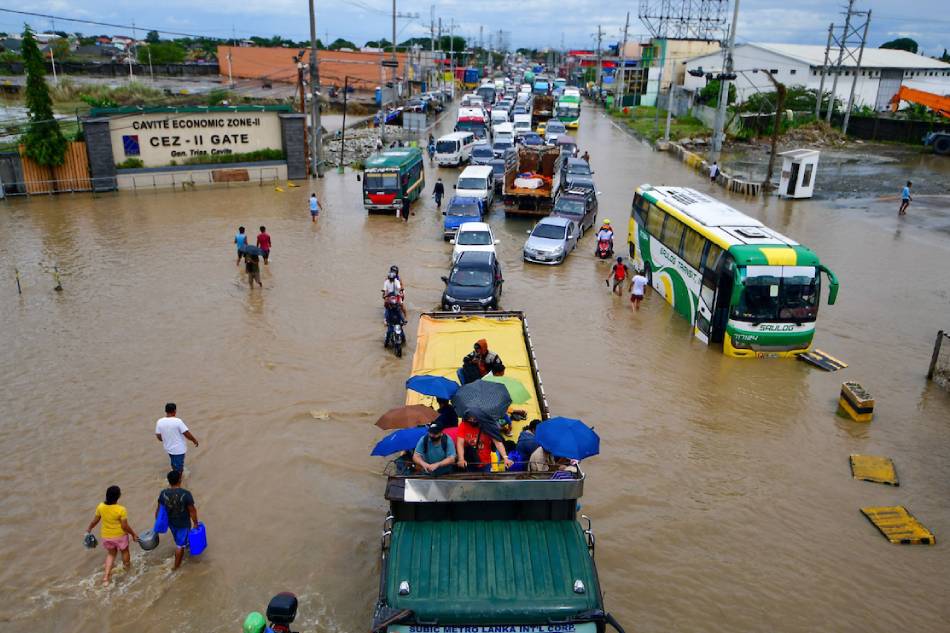 Motorists slowly navigate the flooded Antero Soriano Highway in General Trias, Cavite on October 30, 2022. The heavy rains brought by storm Paeng caused massive flooding in different parts of the country. Mark Demayo, ABS-CBN News/File