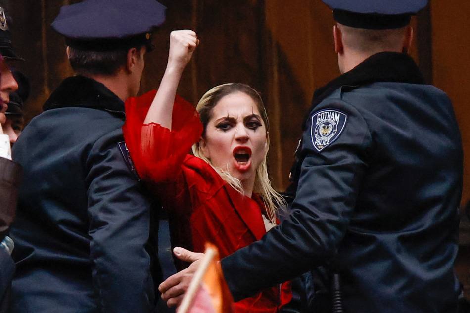Lady Gaga performs during the filming of the movie 'Joker: Folie à Deux' in New York on March 25, 2023. The ‘Joker' sequel starring Lady Gaga and Joaquin Phoenix filmed outside the courthouse where the grand jury investigating former US President Donald Trump meets. Kena Betancur, AFP.