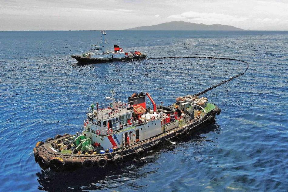The Philippine Coast Guard deploys an oil spill boom and skimmer with manual scooping around the suspected area of the sunken MT Princess Empress in Oriental Mindoro on March 14, 2023. The ship was carrying 800,000 liters of industrial fuel oil when it sank near the Verde Island Passage, one of the most biodiverse marine habitats in the planet, on Feb. 28 threatening economic and environmental damage to the area. Photo courtesy of Malayan Towage and Salvage Corporation/Philippine Coast Guard
