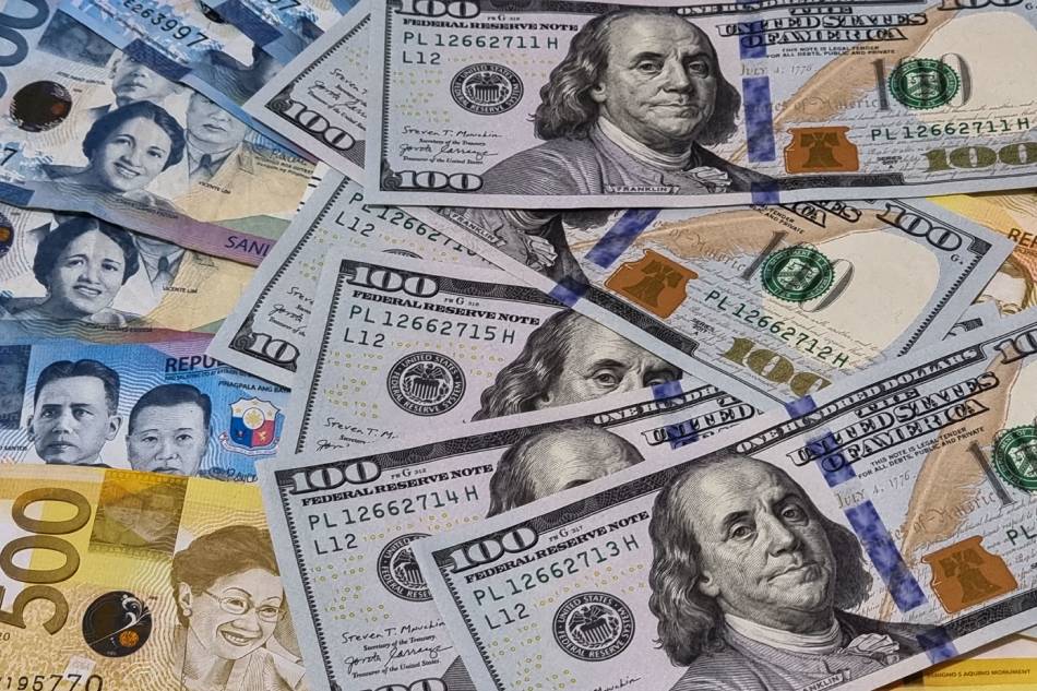 Photo illustration of US dollar to PH peso exchange in this photo taken on September 30, 2022. Gigie Cruz, ABS-CBN News/File