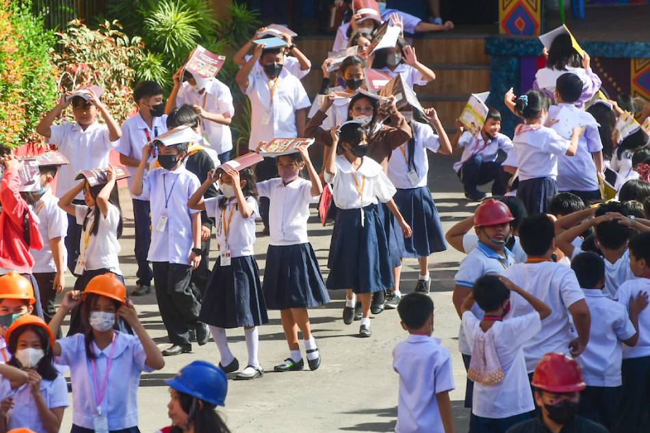 Students of Pres. Corazon Aquino Elementary School in Quezon City leave their classrooms amid an earthquake drill on March 9, 2023. Mark Demayo, ABS-CBN News