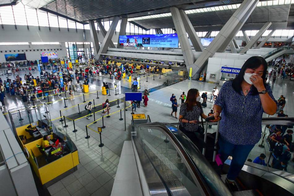 Passengers arrive at the Ninoy Aquino International Terminal 3 in Pasay City on April 5, 2023. More passengers are expected to travel through airports, seaports, and bus terminals on the eve of Maundy Thursday, the start of the long Holy Week break. Mark Demayo, ABS-CBN News