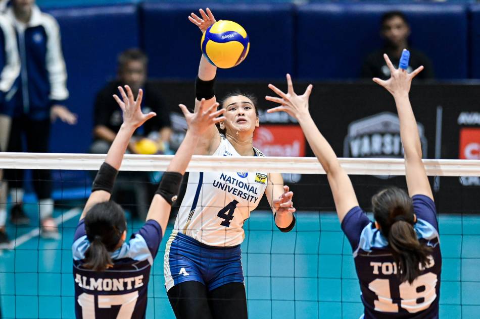 NU star Bella Belen tests the net defense of Adamson University. UAAP Media.