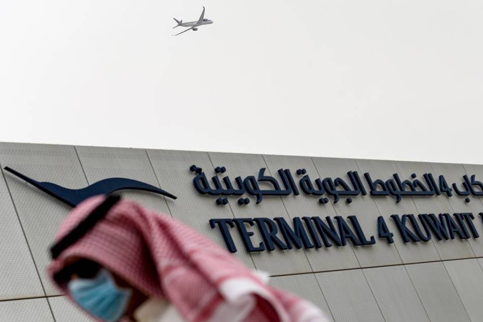 A man walks past a terminal of the Kuwait International Airport in this April 2020 file photo. Noufal Ibrahim, EPA-EFE