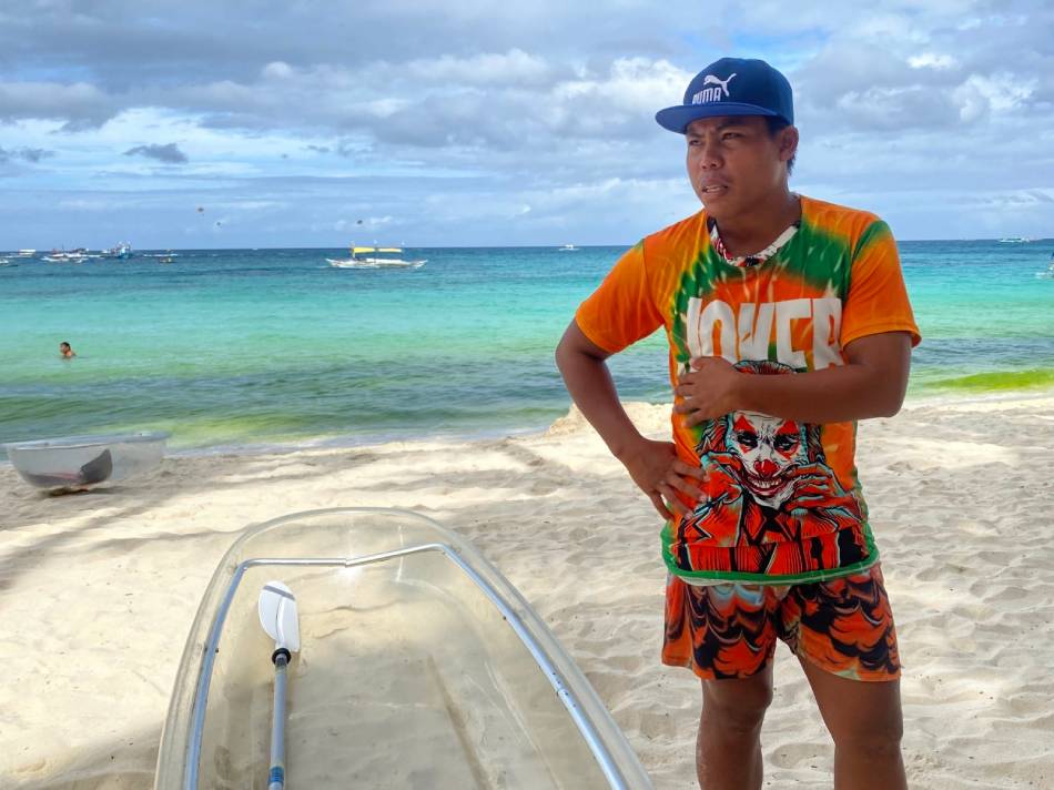 Crystal kaya operator Vince Abresado with his rented kayak. Jessica Fenol, ABS-CBN News.