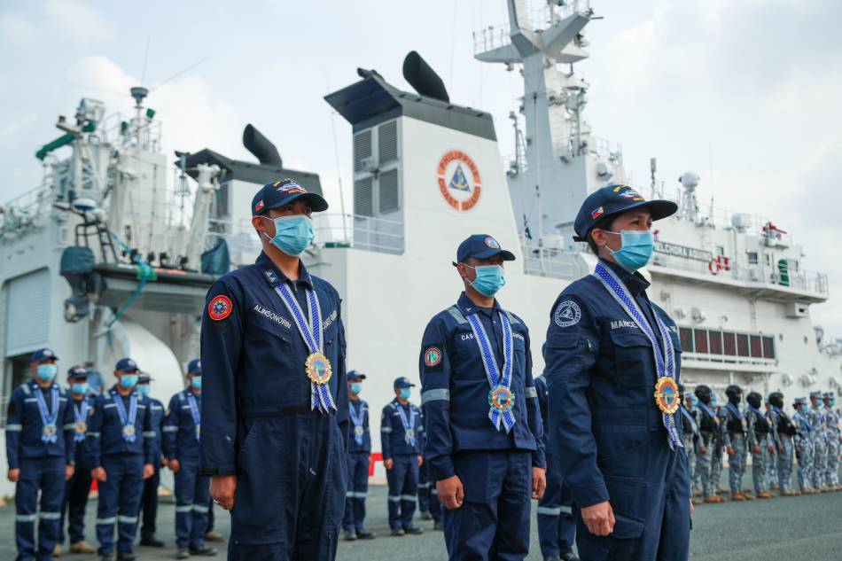 Members of the Philippine Coast Guard are given arrival honors at the Coast Guard Fleet in Pier 13, Port Area, Manila on May 15, 2023, for taking part in the buoy laying operations in the West Philippine Sea. Jonathan Cellona, ABS-CBN News
