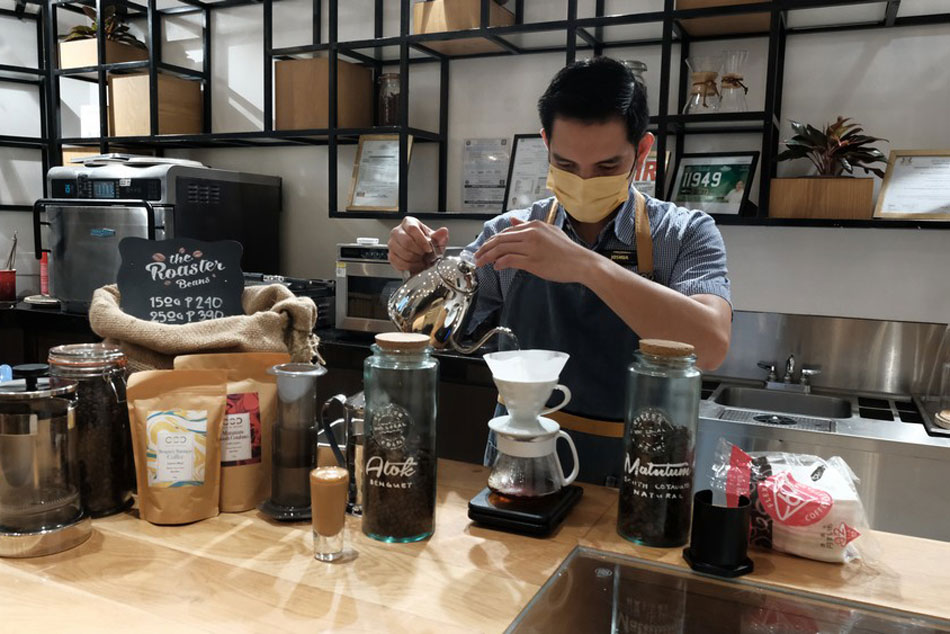  A barista prepares a drink. Jeeves de Veyra