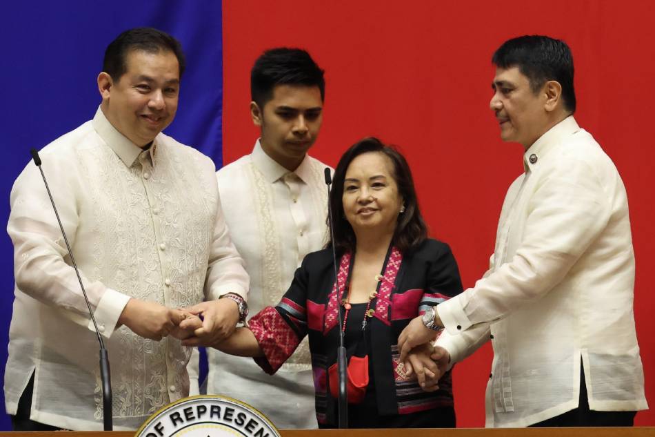 Speaker Ferdinand Martin G. Romualdez shakes hands with Deputy Speaker Gloria Macapagal Arroyo during the oath-taking of Pampanga Rep. Aurelio 'Dong' Gonzales as Senior Deputy Speaker at the plenary hall of the House of Representatives on May 22, 2023. House of Representatives/Handout