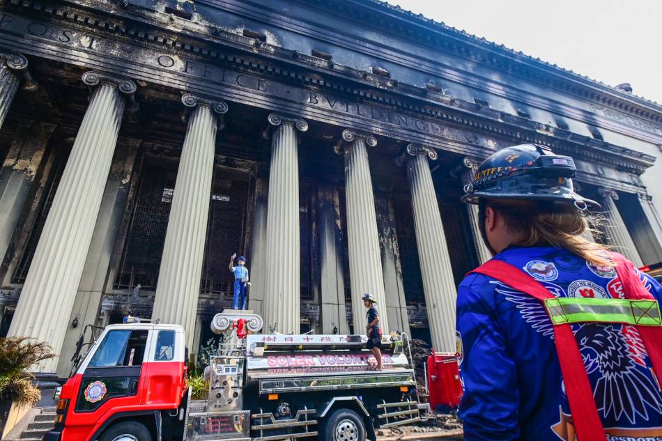 Firefighters inspect the gutted building of Manila Central Post Office in Manila on May 23, 2023. The neo-classical building that was declared an Important Cultural Property was hit by a massive fire, which was raised to general alarm on May 22 and lasted for 30 hours according to BFP. Maria Tan, ABS-CBN News