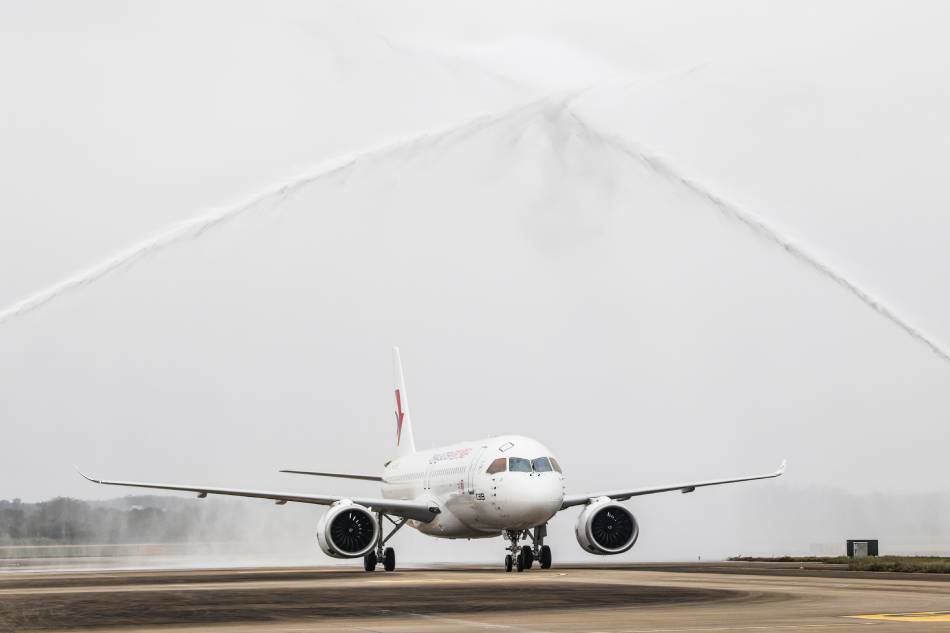 A C919 large passenger aircraft, China's first homegrown large jetliner, passes a water gate after landing at Meilan International Airport in Haikou, Hainan Province, China on Jan. 2, 2023. The aircraft, which belongs to China Eastern Airlines, landed at Meilan International Airport in Haikou on 02 January as part of the 100-hour aircraft validation flight process. The testing process will comprehensively verify the reliability of the C919 with commercial operation in mind, with the aim of ensuring its safety and efficiency. Zhang Liyun, Xinhua/EPA-EFE