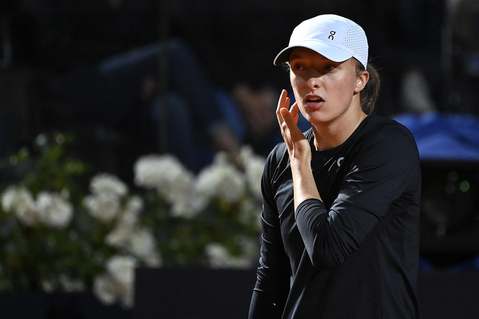 Iga Swiatek of Poland reacts against Elena Rybakina of Kazakhstan (not pictured) during their women's singles quarter-final match at the Italian Open tennis tournament in Rome, Italy, May 17, 2023. Riccardo Antimiani, EPA-EFE.