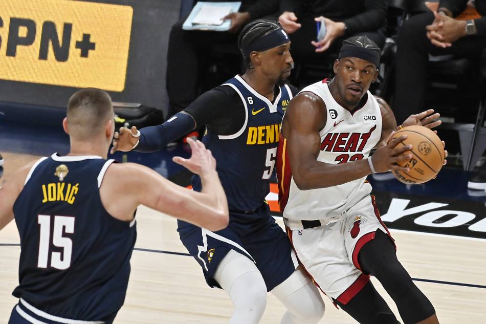 Miami Heat forward Jimmy Butler (R) drives to the basket while being guarded by Denver Nuggets forward Aaron Gordon (C) during the second quarter of Game 2 of the NBA Finals at the Ball Arena in Denver, Colorado, USA, June 4, 2023. Bob Pearson, EPA-EFE.
