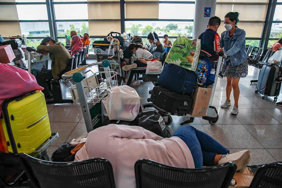 Travelers wait inside the Ninoy Aquino International Airport (NAIA) Terminal 3 in Pasay City on January 4, 2023. Jonathan Cellona, ABS-CBN News/file