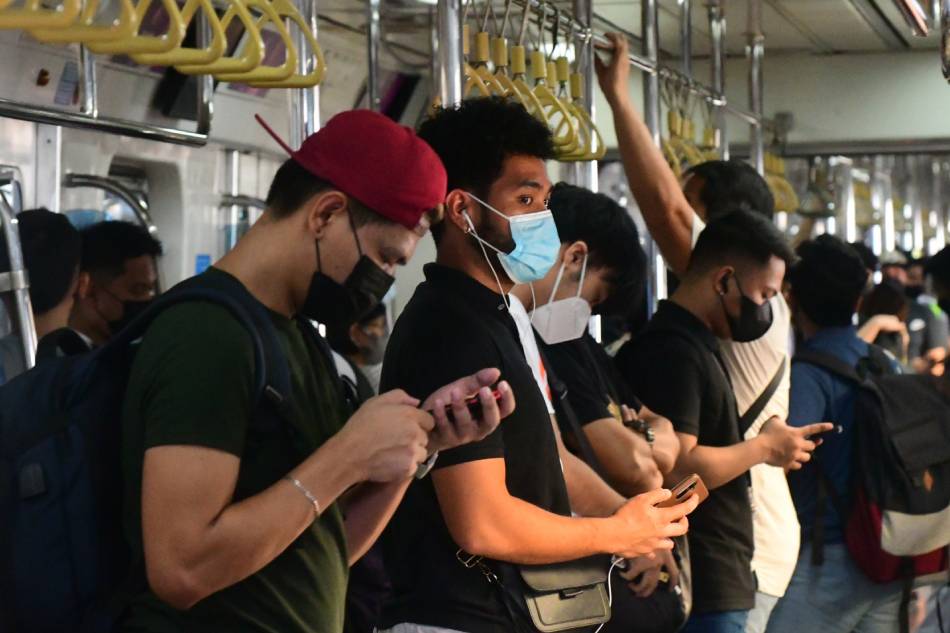 Passengers wear face mask inside an LRT-2 train in Quezon City on April 25, 2023. Mark Demayo, ABS-CBN News/File