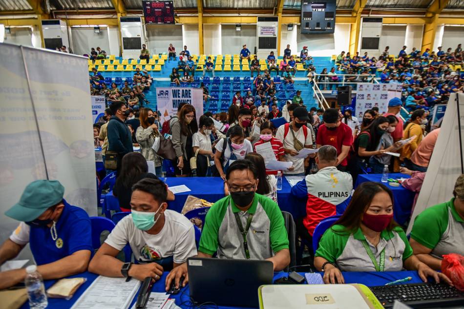 Hopeful job seekers flock to a job fair set up by the local government of Malolos, Bulacan in line with the 125th Independence day celebration on June 12, 2023. The Labor department organized simultaneous “Kalayaan Job fair” in different parts of the country. Maria Tan, ABS-CBN News/File.
