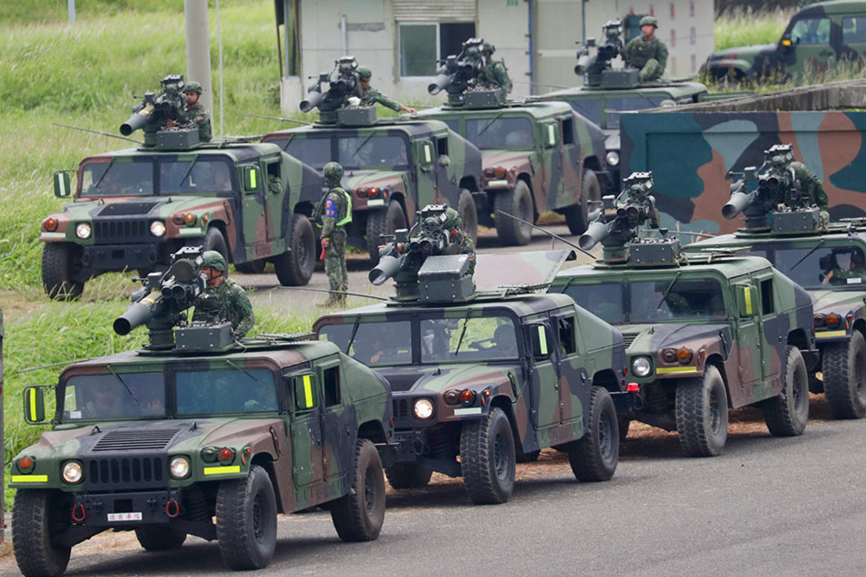 Taiwan military Humvees armed with US-made TOW A2 missiles maneuver during the missile shooting exercises in Fangshan, Pingtung county, Taiwan, 03 July 2023. In the past year, Taiwan has increased production of its anti-ship and air defense missiles amid rising tensions with China. EPA-EFE/RITCHIE B. TONGO