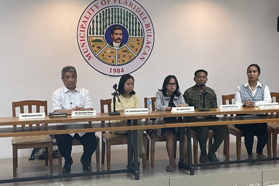 Environmental activists Jonila Castro and Jhed Tamano appear with government officials in a press conference in Plaridel, Bulacan on Sept. 19, 2023. Jeff Caparas, ABS-CBN News 