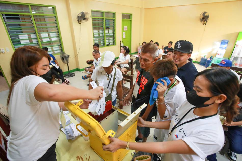 Poll watchers make sure a ballot box is empty before they start the count at the end of voting at the Paranaque Elementary School Central in Paranaque City on October 30, 2023. Jonathan Cellona, ABS-CBN News/file