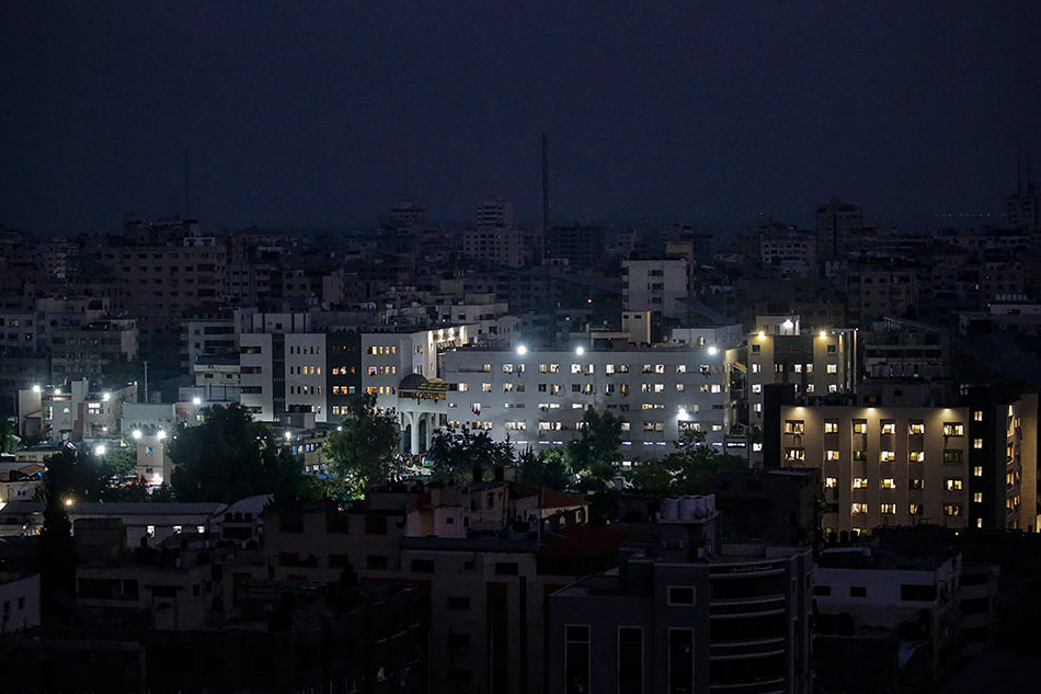 Al Shifa hospital is lit up in Gaza City on October 24, 2023. Mohammed Saber, EPA-EFE.