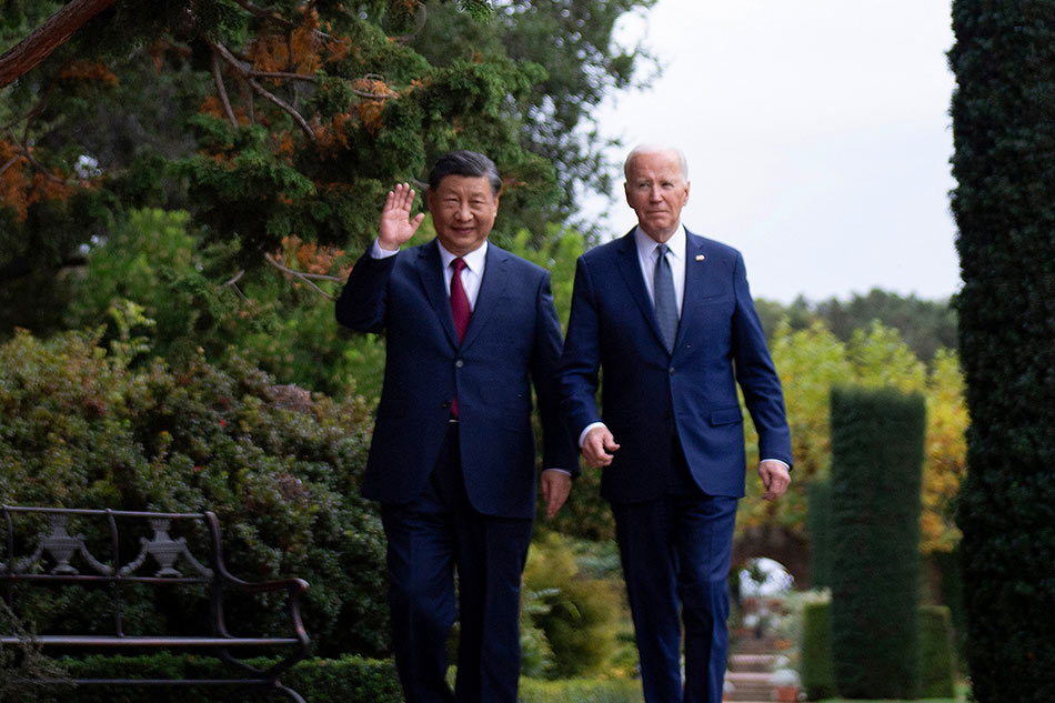 US President Joe Biden and Chinese President Xi Jinping walk together after a meeting during the Asia-Pacific Economic Cooperation (APEC) Leaders' week in Woodside, California on Nov. 15, 2023. Brendan Smialowski, AFP