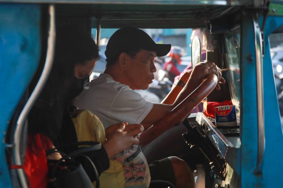 Commuters wait in line for a ride at a public utility jeepney (PUJ) terminal in PhilCoa , Quezon City on November 20, 2023. Jonathan Cellona, ABS-CBN News