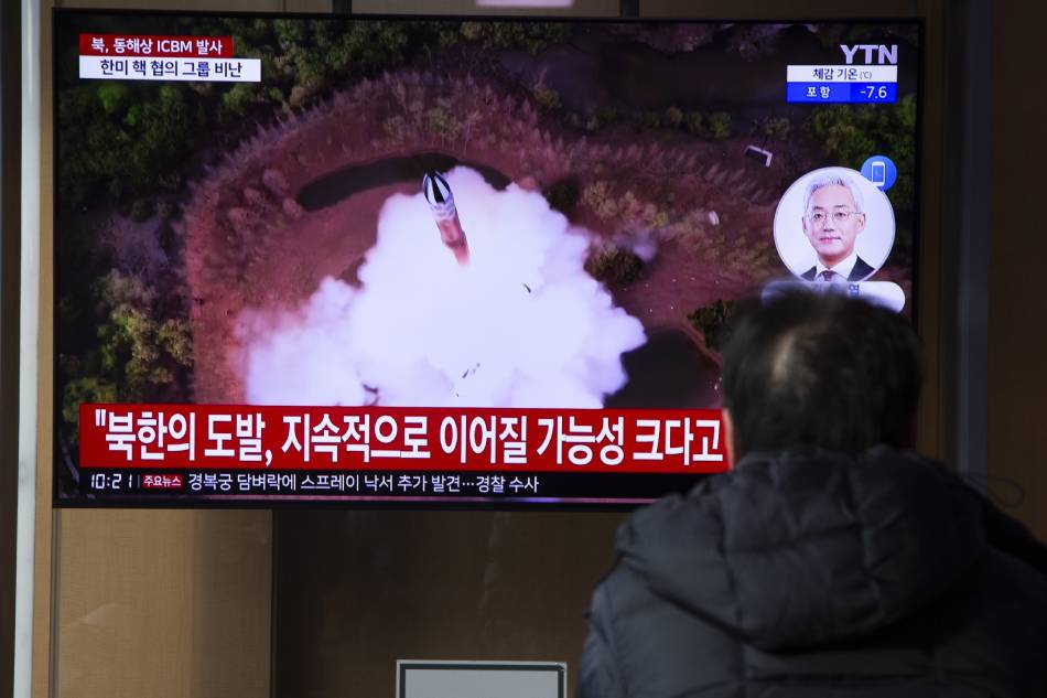 A man watches the news at a station in Seoul, South Korea, 18 December 2023. According to South Korea