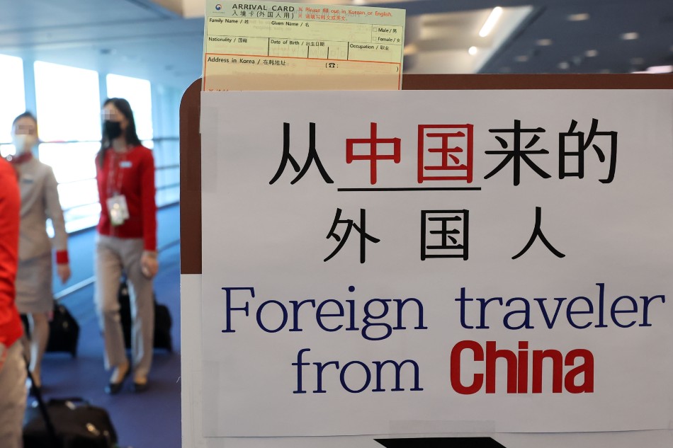 A line exclusively for entrants from China is set up to guide them to a COVID-19 testing station upon arrival at Incheon International Airport in Incheon, South Korea, Jan. 2, 2023, when South Korea began to require PCR tests for all travelers from China as the virus explosively spreads in the neighboring country. EPA-EFE/YONHAP SOUTH KOREA OUT