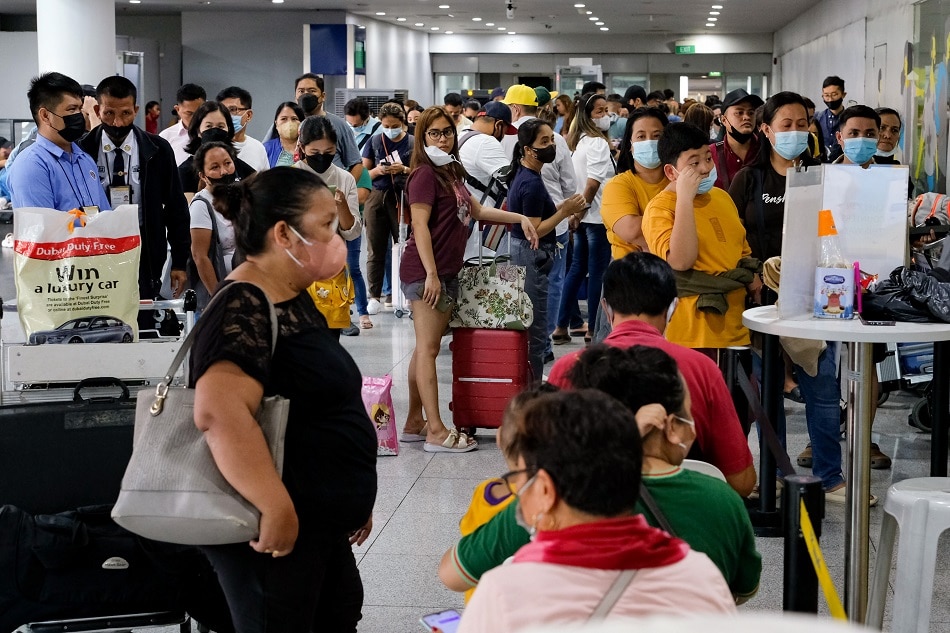 Passengers line up outside the office of Cebu Pacific at the NAIA Terminal 3 in Pasay City to rebook their flights on January 2, 2023. The Civil Aviation Authority of the Philippines’ (CAAP) Air Traffic Management Center experienced technical problems on New Year’s day affecting 65,000 passengers with the cancellation of hundreds of flights according to DOTr. George Calvelo, ABS-CBN News