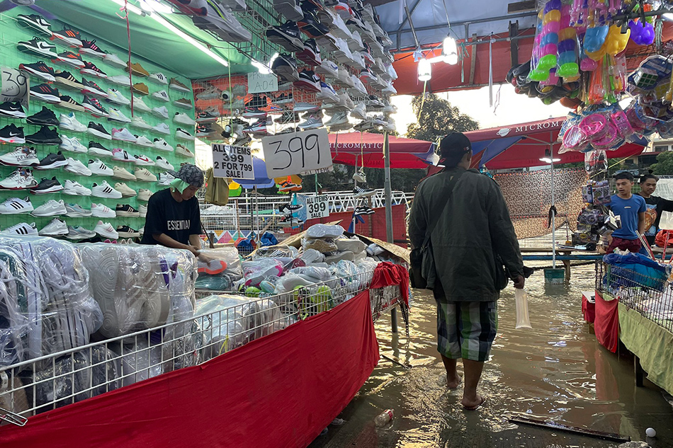A bazaar stall along the Marikina River is forced to close after water reached its location on Thursday afternoon. Anna Cerezo, ABS-CBN News
