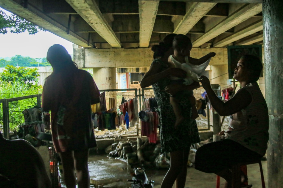 Informal settlers living near the Marikina River wait for the weather clear on September 29, 2022 before dealing with mud and debris brought by Typhoon Karding in San Mateo, Rizal. Jonathan Cellona, ABS-CBN News/File