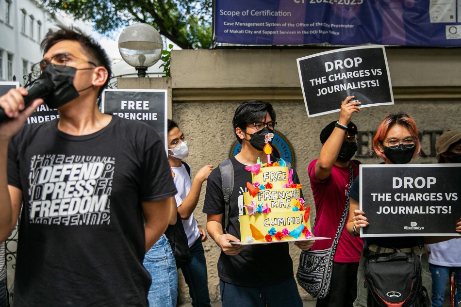 Members of the Altermidya Network, community and campus journalists, and other media practitioners rally at the Department of Justice in Manila Monday to call for the release of journalist Frenchie Mae Cumpio. Tacloban-based journalist Cumpio was arrested 3 years ago allegedly over trumped up charges of illegal possession of firearms and explosives. Mark Z. Saludes, ABS-CBN News
