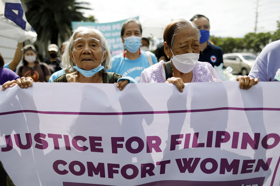  Narcisa Claveria (L) and Estelita Dy (R), survivors of the Japanese military's sexual slavery during World War II, hold a banner during a protest rally in front of the Japanese embassy in Manila on January 31, 2023. Elderly Claveria and Dy, two of the few surviving Filipino women who were forcibly taken by the Japanese army as sex slaves during the war, called for justice. The protest rally coincides with the presentation of Japan's human rights report before the United Nations Human Rights Council (UNHRC) in Geneva, Switzerland. Francis R. Malasig, EPA-EFE/File