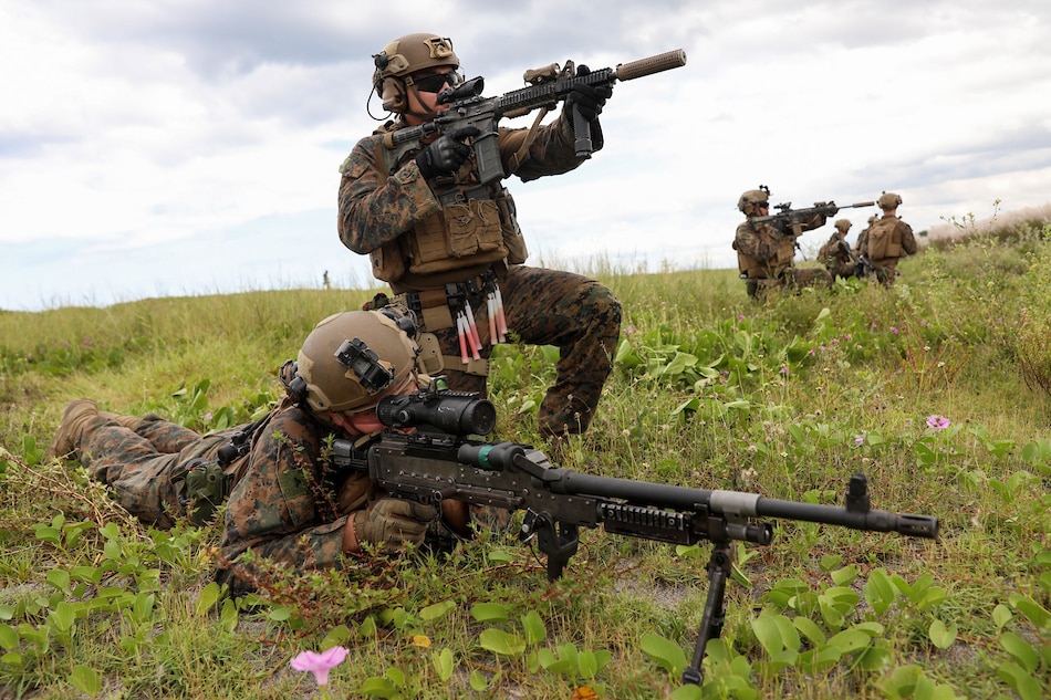 An American soldier assists a Philippine marine as they conduct a chemical reconnaissance and surveilllance exercise during 'Kamandag, Cooperation of the Warriors of the Sea,” a joint the US-Philippines military exercise in Zambales on Oct. 7, 2022. Basilio H. Sepe, ABS-CBN News/File