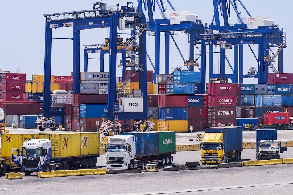 Container vans stacked together are seen inside the Philippine Ports Authority compound in Manila on April 1, 2020. George Calvelo, ABS-CBN News/File