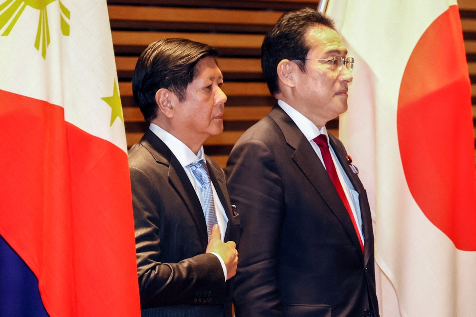 Philippine President Ferdinand Marcos (L) and Japanese Prime Minister Fumio Kishida (R) listen to their national anthems at the prime minister's official residence in Tokyo on February 9, 2023. Yoshikazu Tsuno, Pool/AFP/file